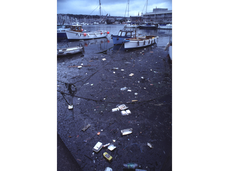 Modal: Litter floating in Sutton harbour.